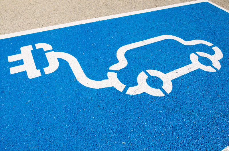 e-charging car sign on pavement