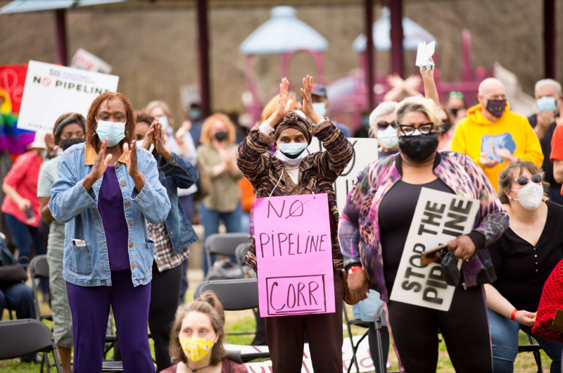 protestors holding pipeline posters