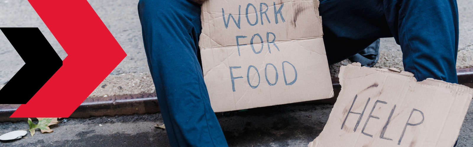 person holding work for food sign